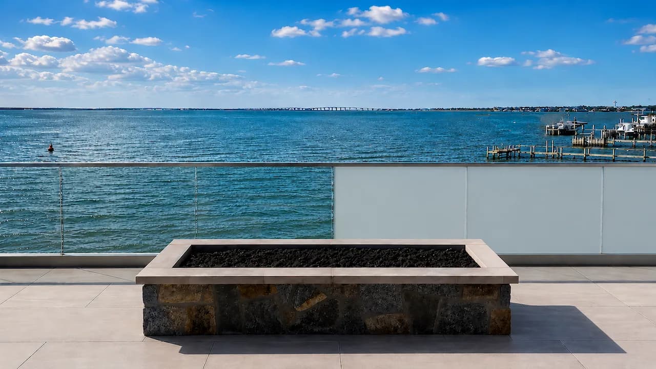 Switchable privacy glass railing on a New York waterfront terrace
