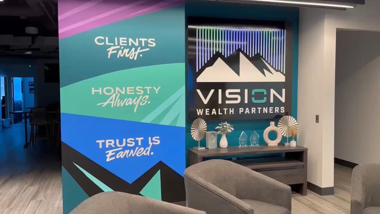 Vision Wealth Partners office with branded graphics printed on PriWatt smart glass