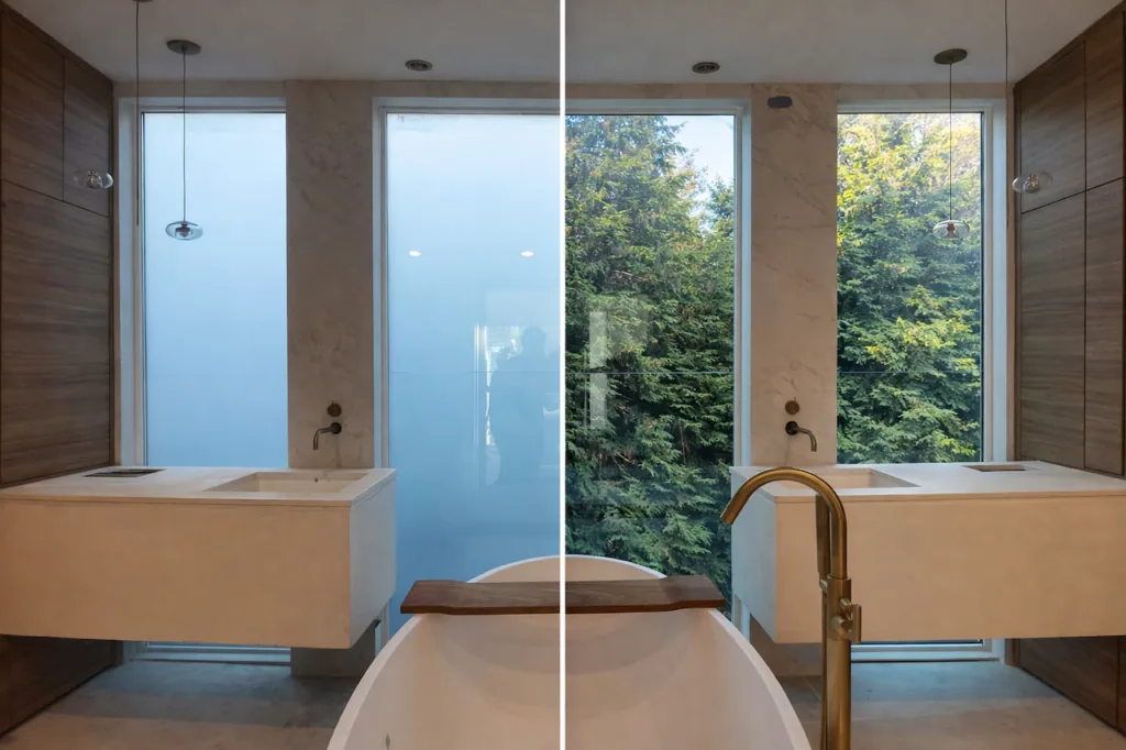 A shower enclosure glazed with switchable privacy glass, switched frosted