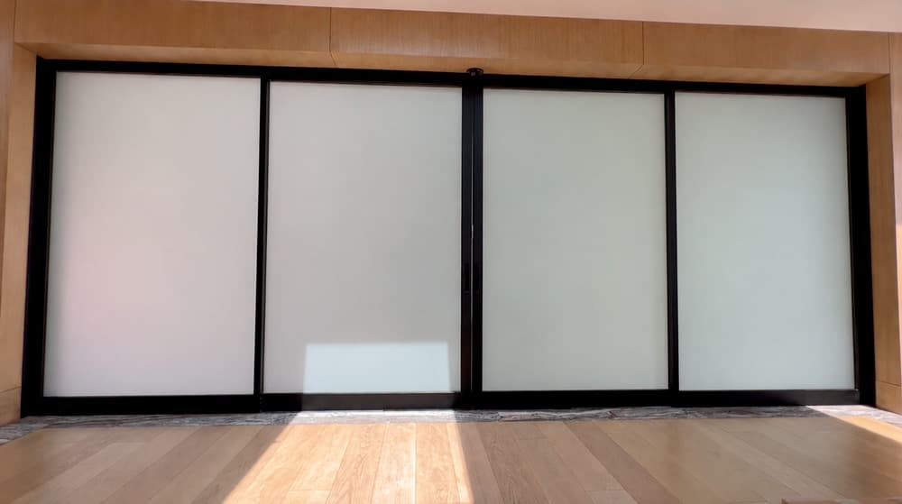 Home sliding doors with PriWatt smart glass in privacy mode