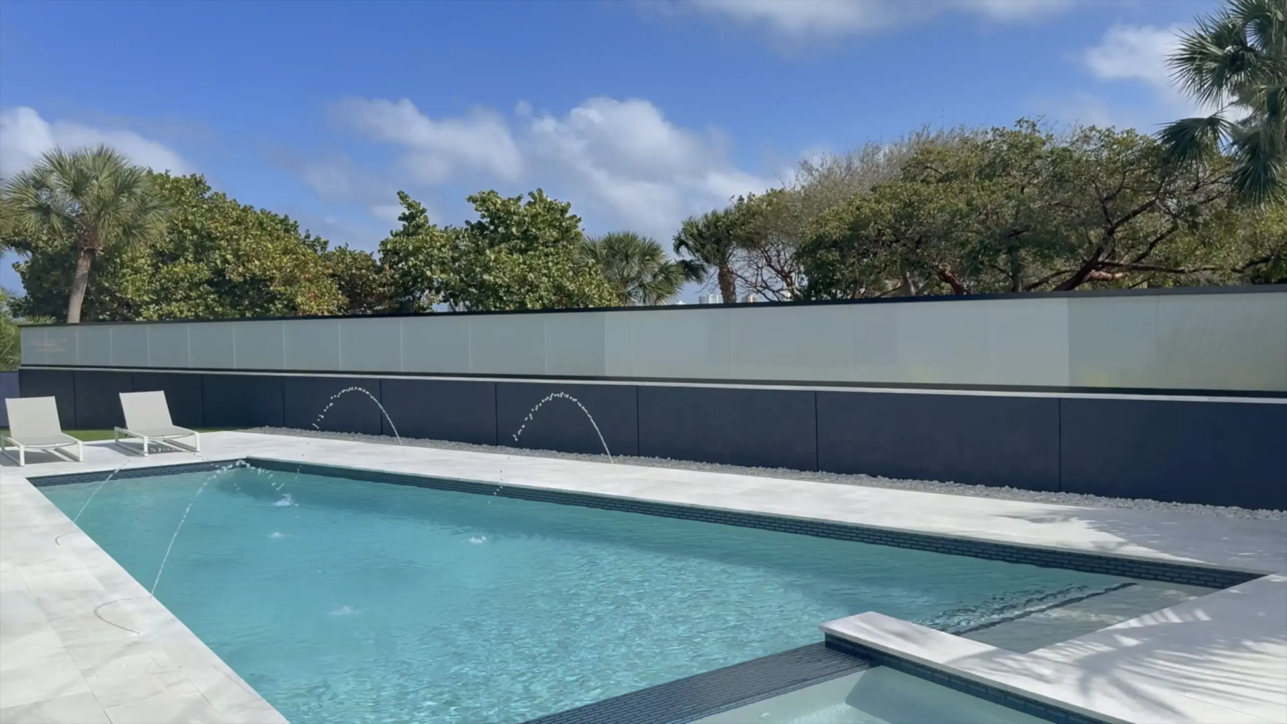 Poolside PriWatt smart glass railing in transparent mode