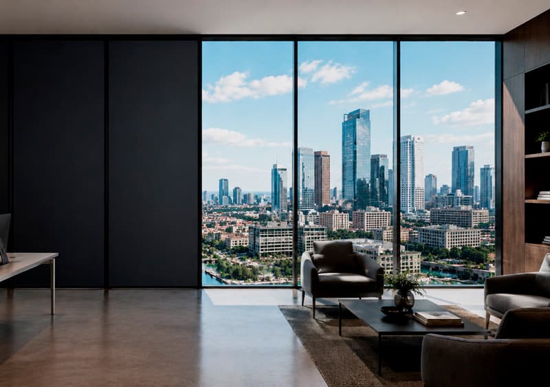 PriWatt DLC smart glass panoramic window overlooking a city skyline