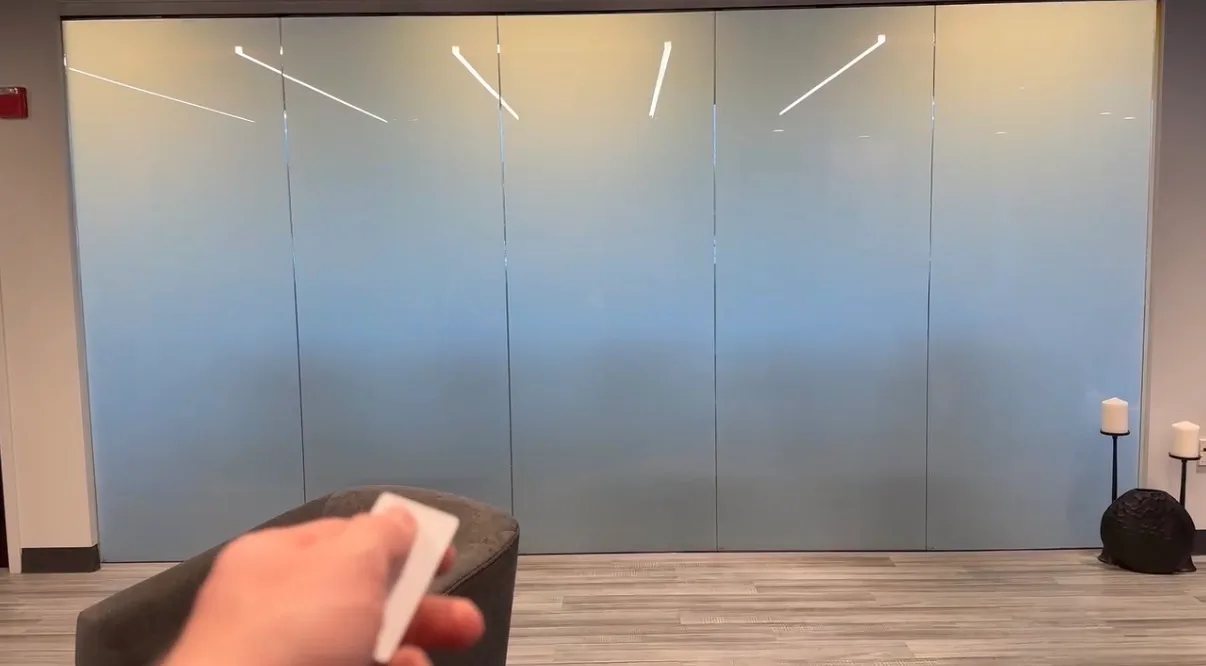 The same wall switched to privacy for a client meeting