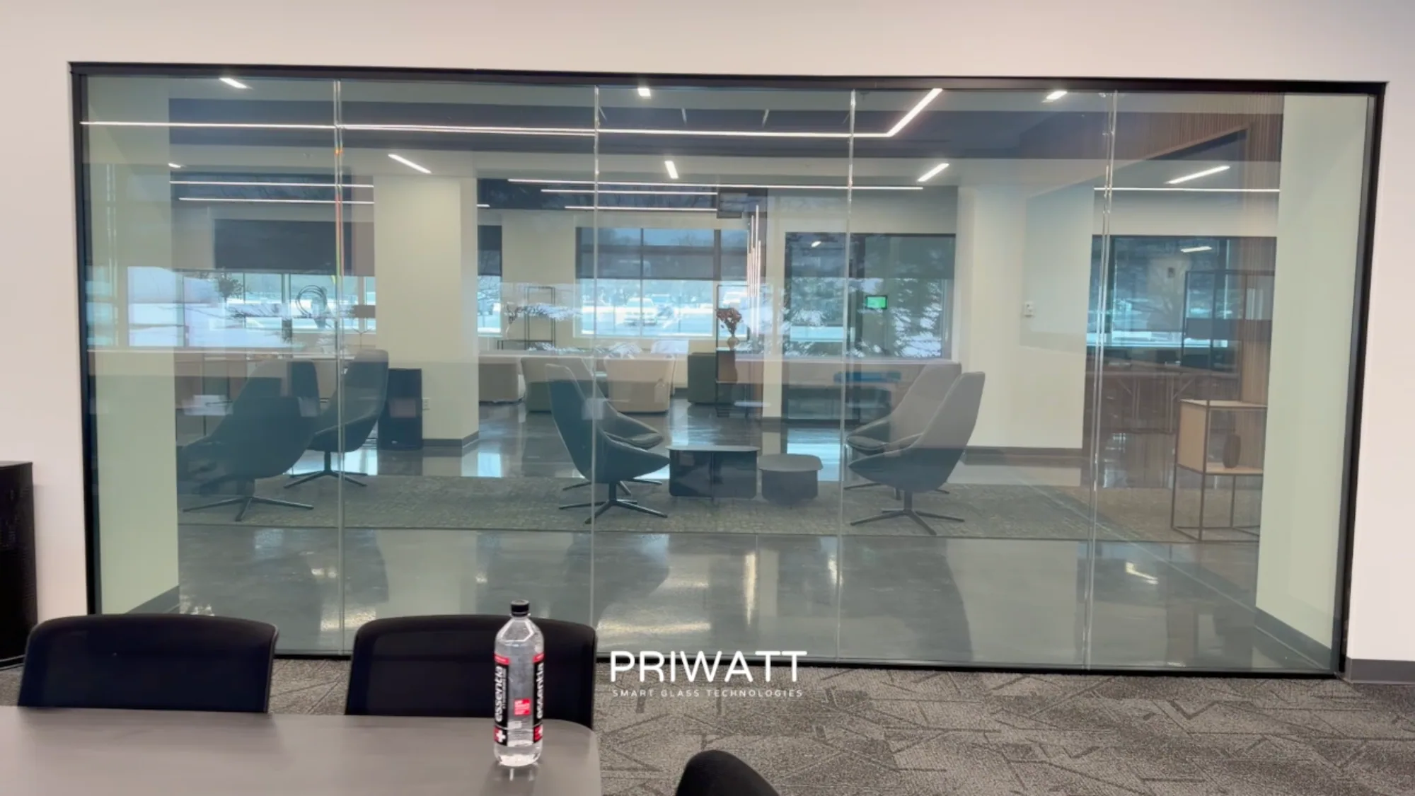 A GE Vernova conference room behind PriWatt switchable glass, clear