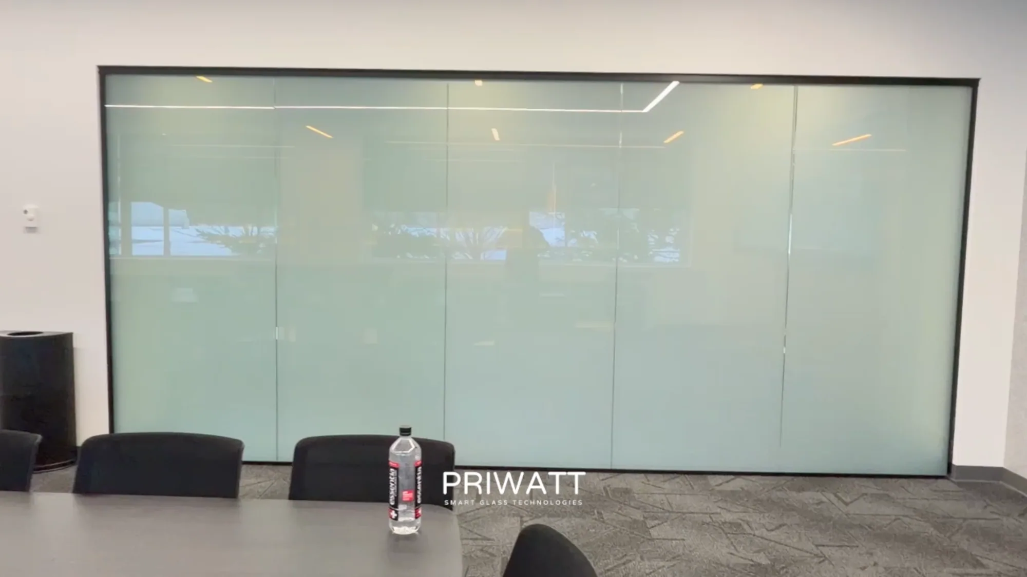 The same conference room switched to privacy, the glass opaque