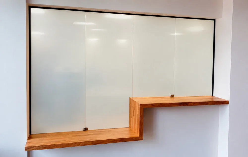 Reception window with PriWatt smart glass in privacy mode