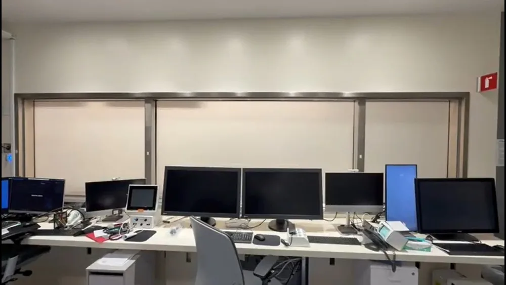 Monitors and workstations behind the switchable glass partition