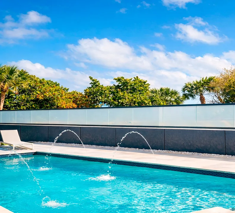 Pool terrace with PriWatt smart glass railing in North Palm Beach