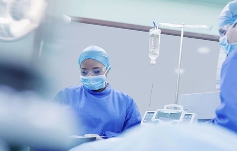 An operating theatre seen through switchable glass