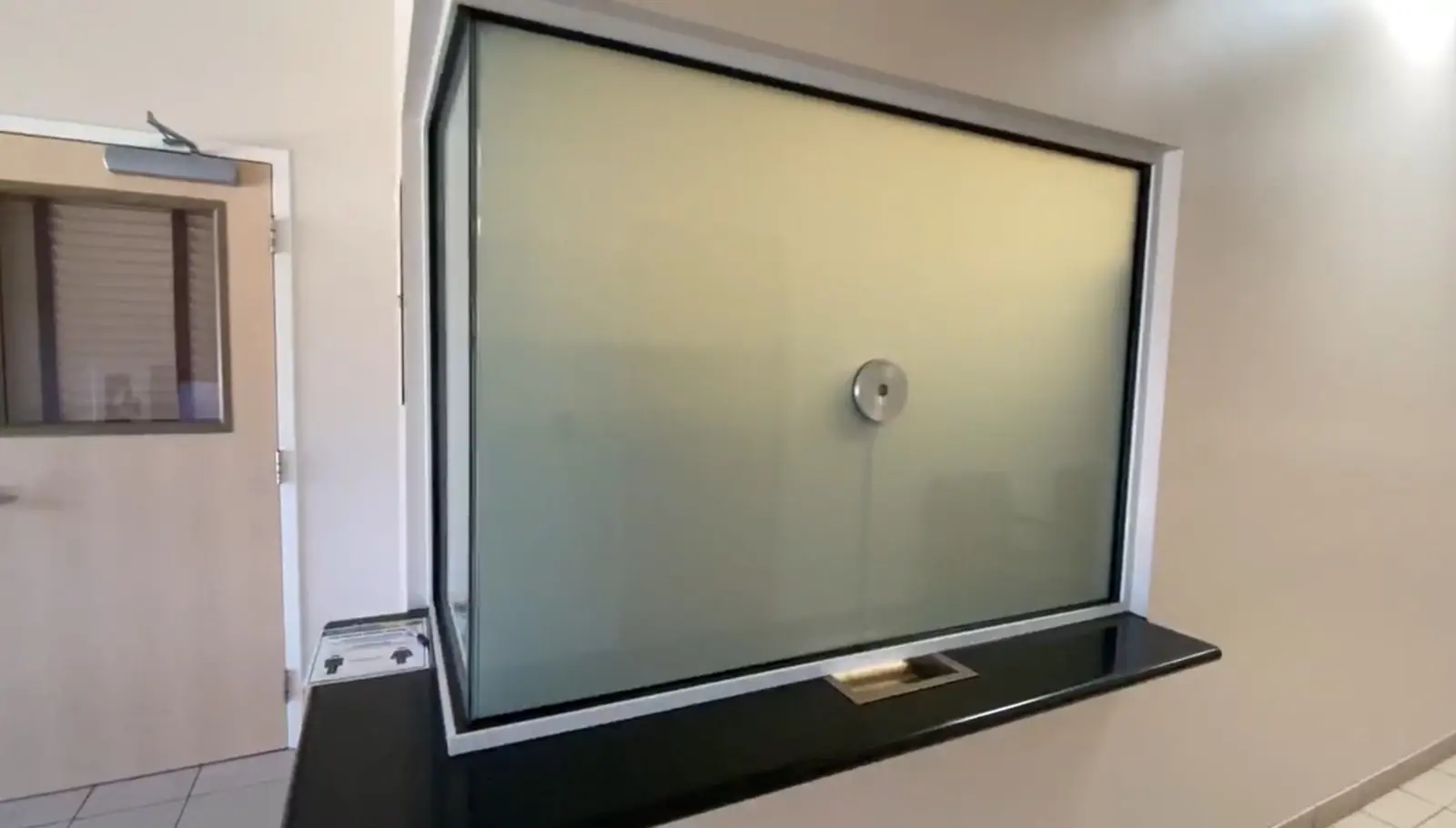 The same glazing switched to its private state