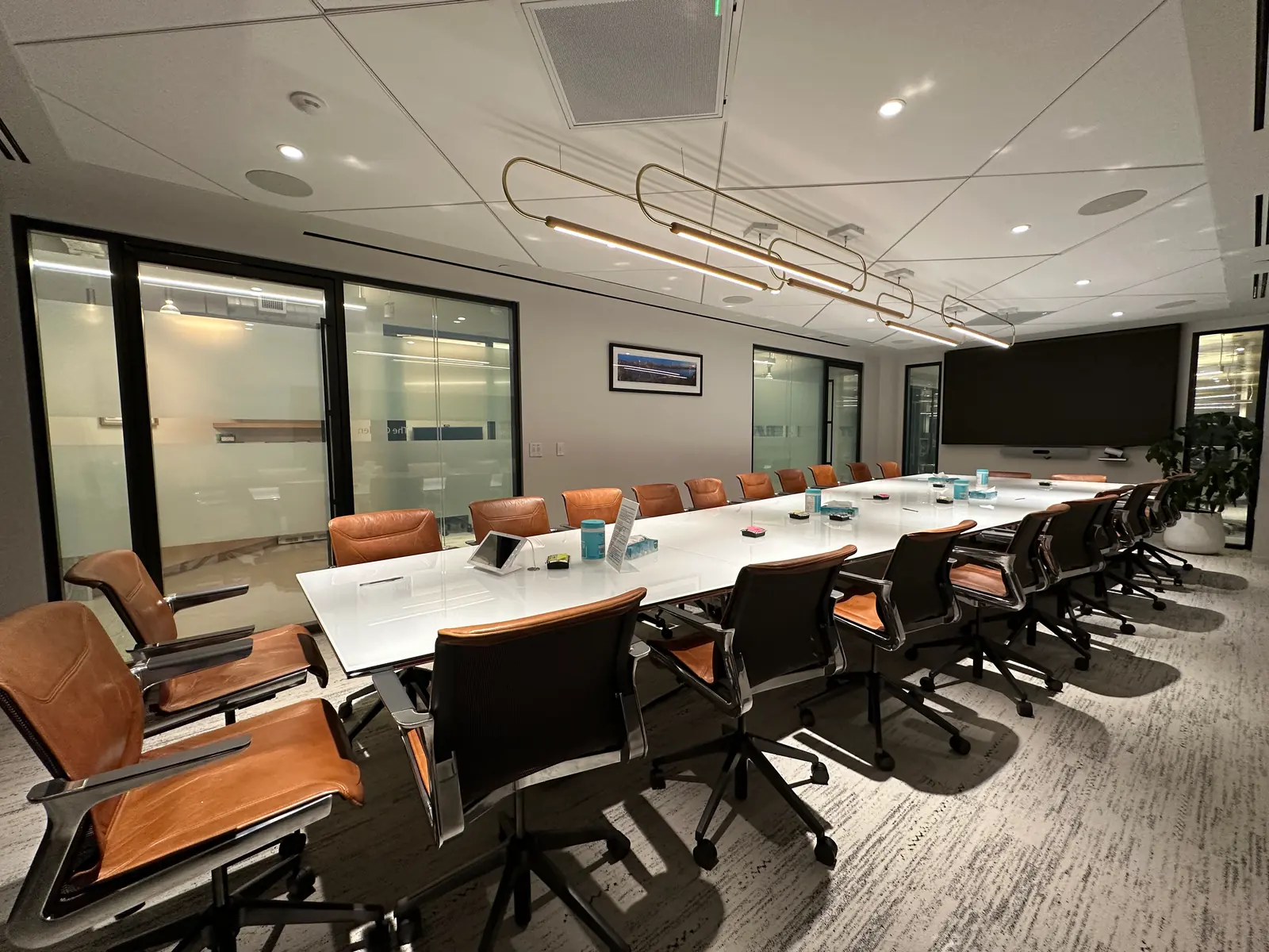 Glazed meeting rooms at Ipsen’s New York office with the film clear