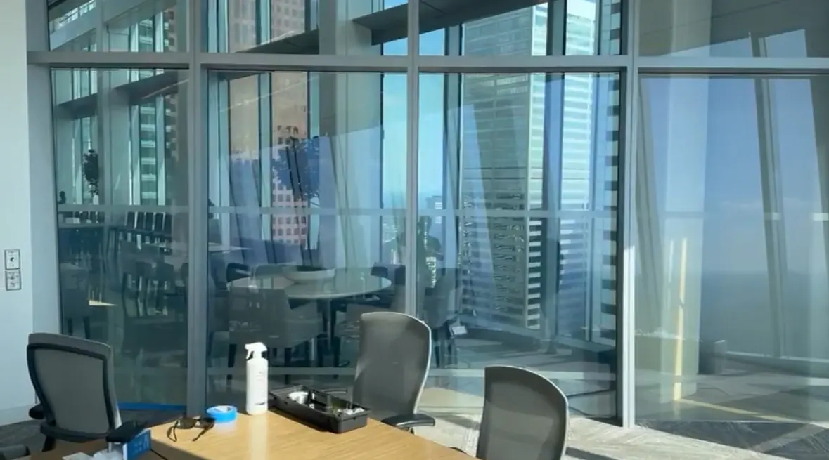 A glazed meeting room at EY Toronto with the film in its clear state