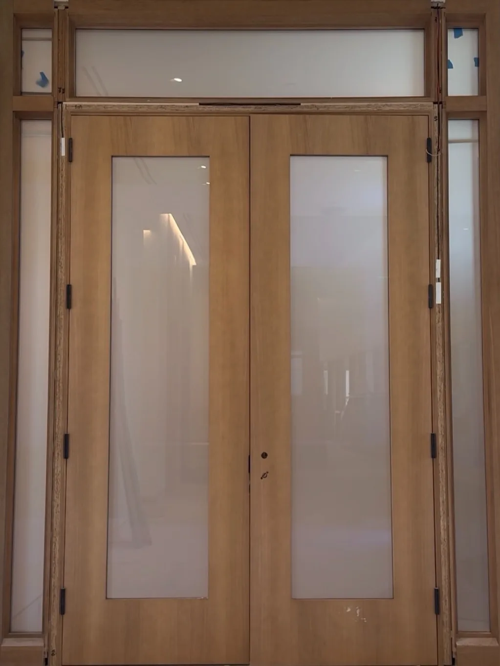 The same double door switched to privacy, both panels an even white with nothing visible behind them